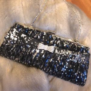 Hand stitched clutch